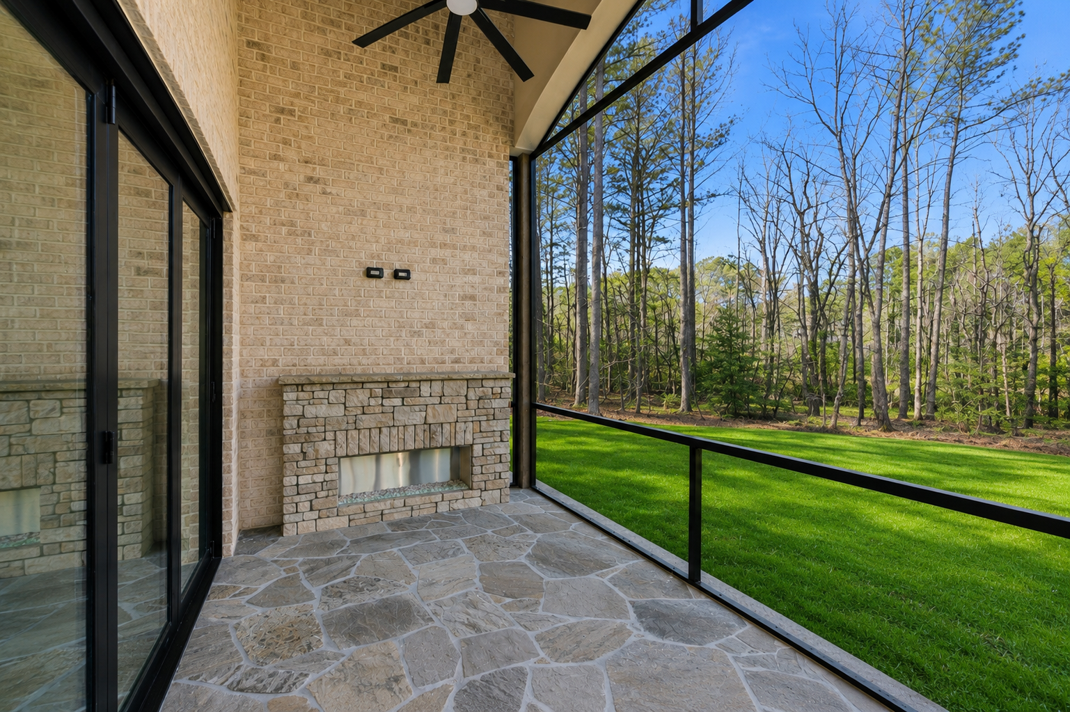 Screened Porch: Arched porch interior with stone fireplace in LANCASTER, SC