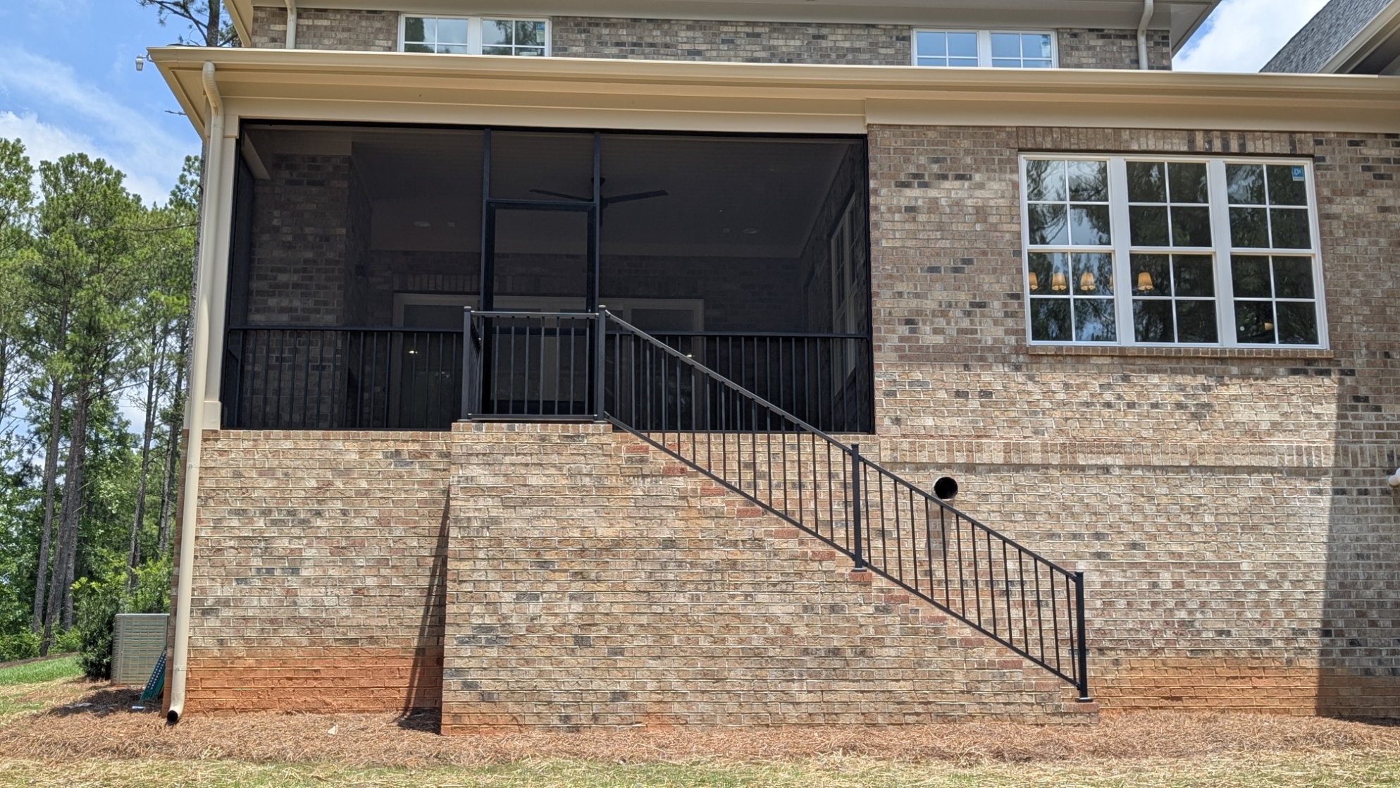 Screened Porch: Elevated brick porch with stair railing in MOUNT HOLLY, NC